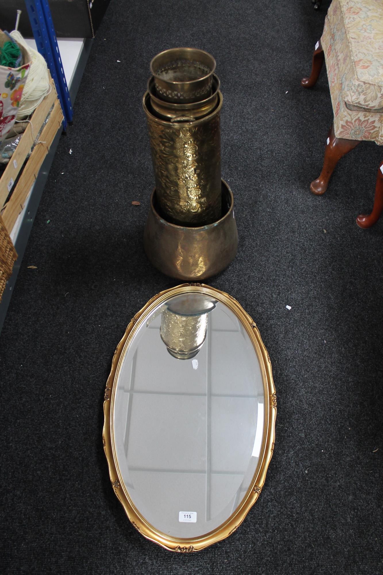 A gilt framed mirror together with a copper pot,