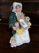 A Royal Doulton figure - The Rag Doll Seller HN 2944