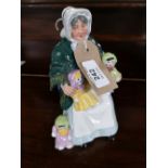 A Royal Doulton figure - The Rag Doll Seller HN 2944