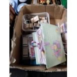 A box of cigarette and tea cards