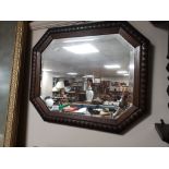 An Edwardian oak mirror