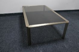 A metal and glass topped coffee table