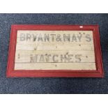 A Bryant & May's Matches advertisement on board in frame