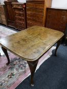 A mid century reproduction dining table and six chairs