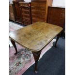 A mid century reproduction dining table and six chairs