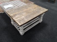 A reclaimed pine painted base coffee table