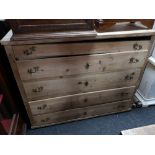 A nineteenth century pine five drawer chest