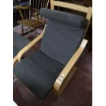 An Ikea beach relaxer chair with footstool