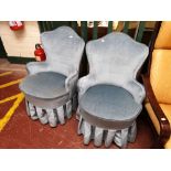 A pair of mid century bedroom chairs in turquoise fabric.