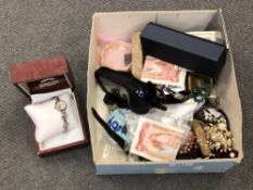 A box of costume jewellery, banknotes,