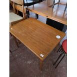 An extending teak low table.