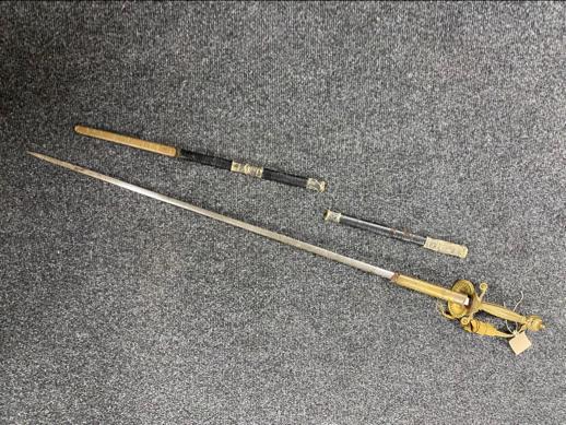 An antique court sword with etched blade,