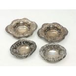 Two pairs of silver repousse dishes