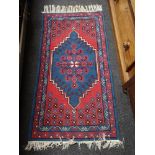 A Persian rug of geometric design,