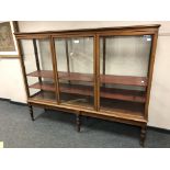 A Victorian mahogany glazed triple door cabinet, width 219 cm, height 172 cm, depth 52 cm.