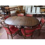 A Regency style pedestal dining table and six chairs.