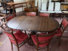 A Regency style pedestal dining table and six chairs.