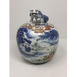 A Chinese porcelain ginger jar, the lid with surmounted foo dog,