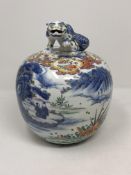 A Chinese porcelain ginger jar, the lid with surmounted foo dog,