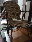 A Scandinavian Windsor style elm armchair.