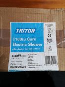 A Triton electric shower in box