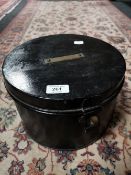 An antique metal hat box