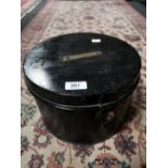 An antique metal hat box