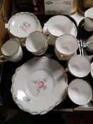 A tray of English bone china gilded tea set