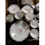 A tray of English bone china gilded tea set