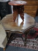An Edwardian mahogany occasional table and carved small table