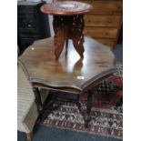 An Edwardian mahogany occasional table and carved small table