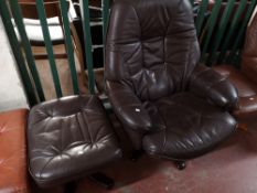 A brown leather relaxer chair with footstool.