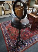 An early Victorian Gentleman's shaving stand on carved pedestal tripod base