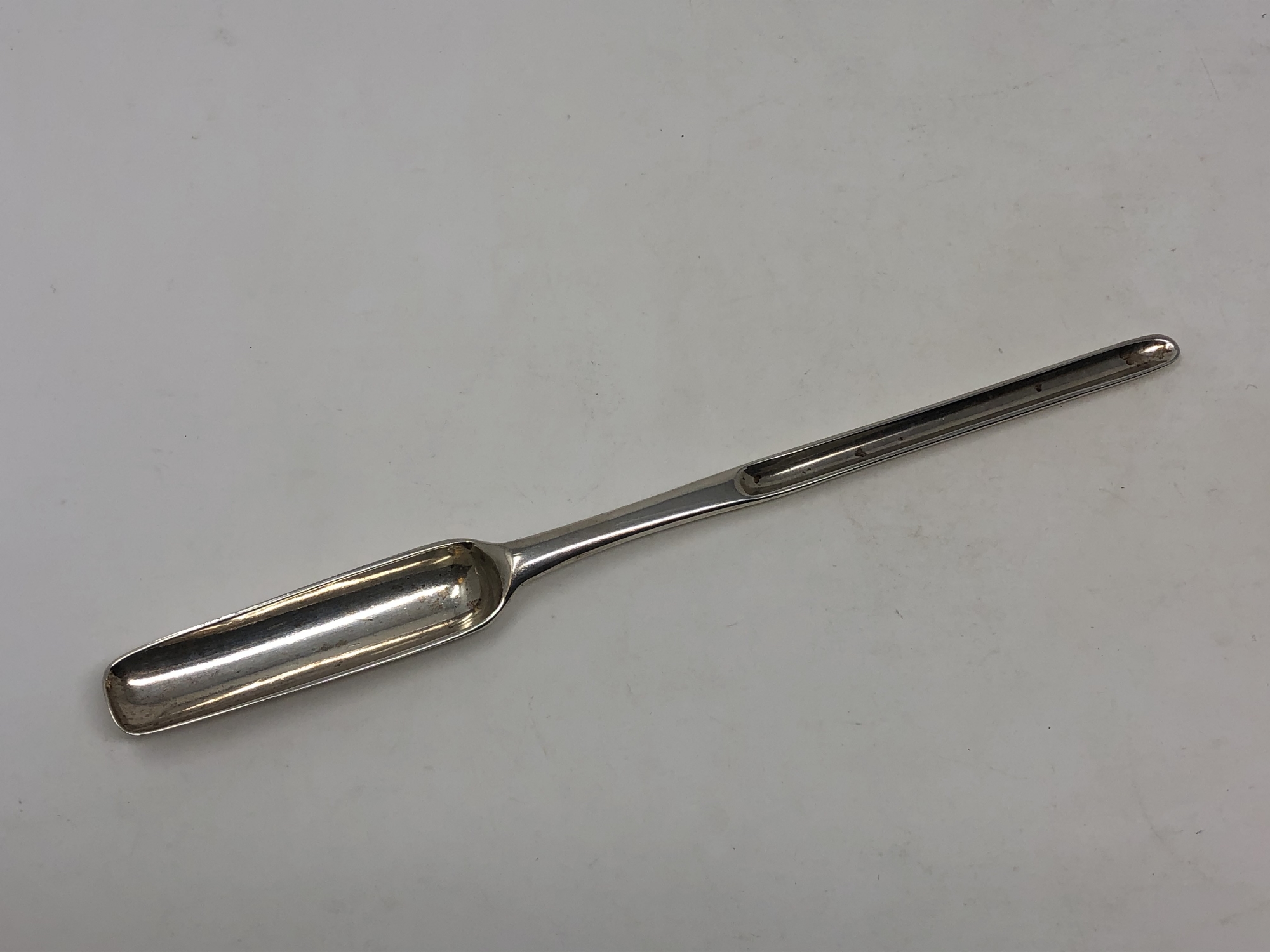 A fine George I silver marrow scoop, probably James Wilks,