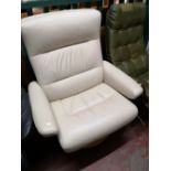 A cream leather relaxer chair.