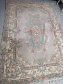 A fringed Chinese carpet,