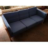 A beech framed three seater settee.