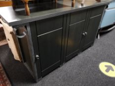 A contemporary sideboard fitted with three drawers