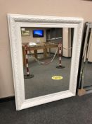 A painted white traditional style mirror,