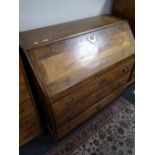 A nineteenth century oak bureau fitted with three drawers