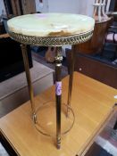 An onyx and brass plant stand