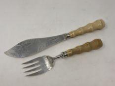 A fine pair of Victorian silver and ivory fish servers, Harrison & Howson, Sheffield 1880,