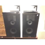 A pair of Dantax speakers on stands.