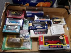 A box of die cast model vehicles,