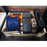 A crate of extension lead, paint stripper,