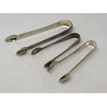 A pair of Georgian silver sugar tongs and two other silver pairs (3) CONDITION REPORT:
