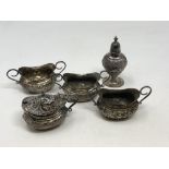 An ornate Victorian five piece silver condiment set, Walker & Hall,