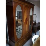 A three piece inlaid mahogany Edwardian bedroom suite