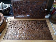 A wooden African panel together with an Eastern panel
