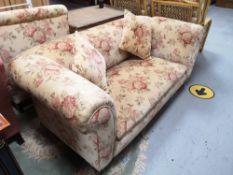 A Victorian two seater settee with scatter cushions